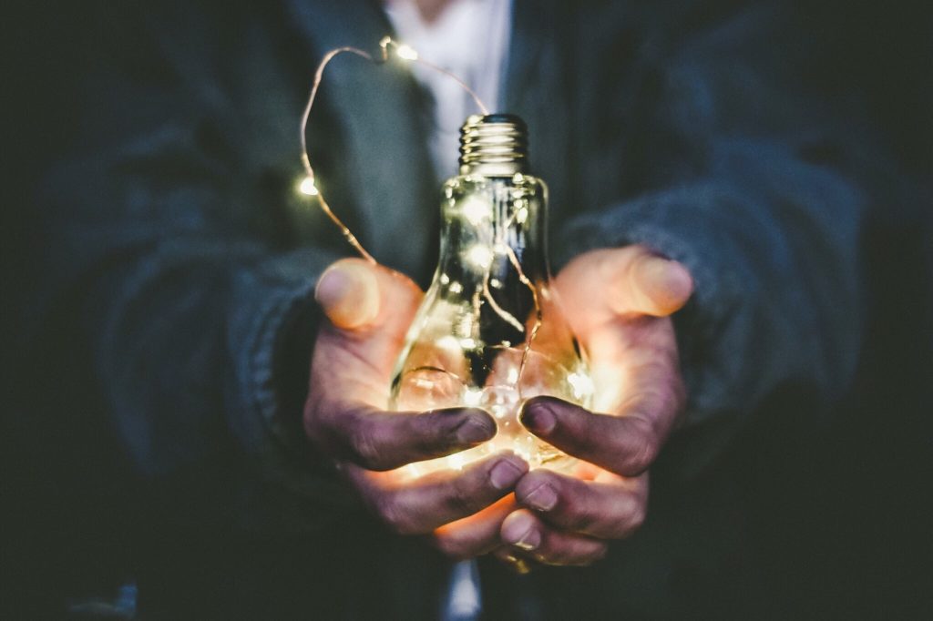 Man holding light bulb
